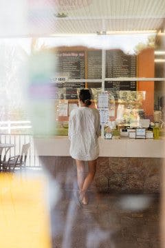 woman waiting to buy coffee